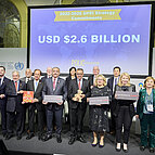 Group picture holding signs committing the end of Polio